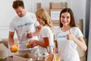 Volunteers preparing food and supplies for charity