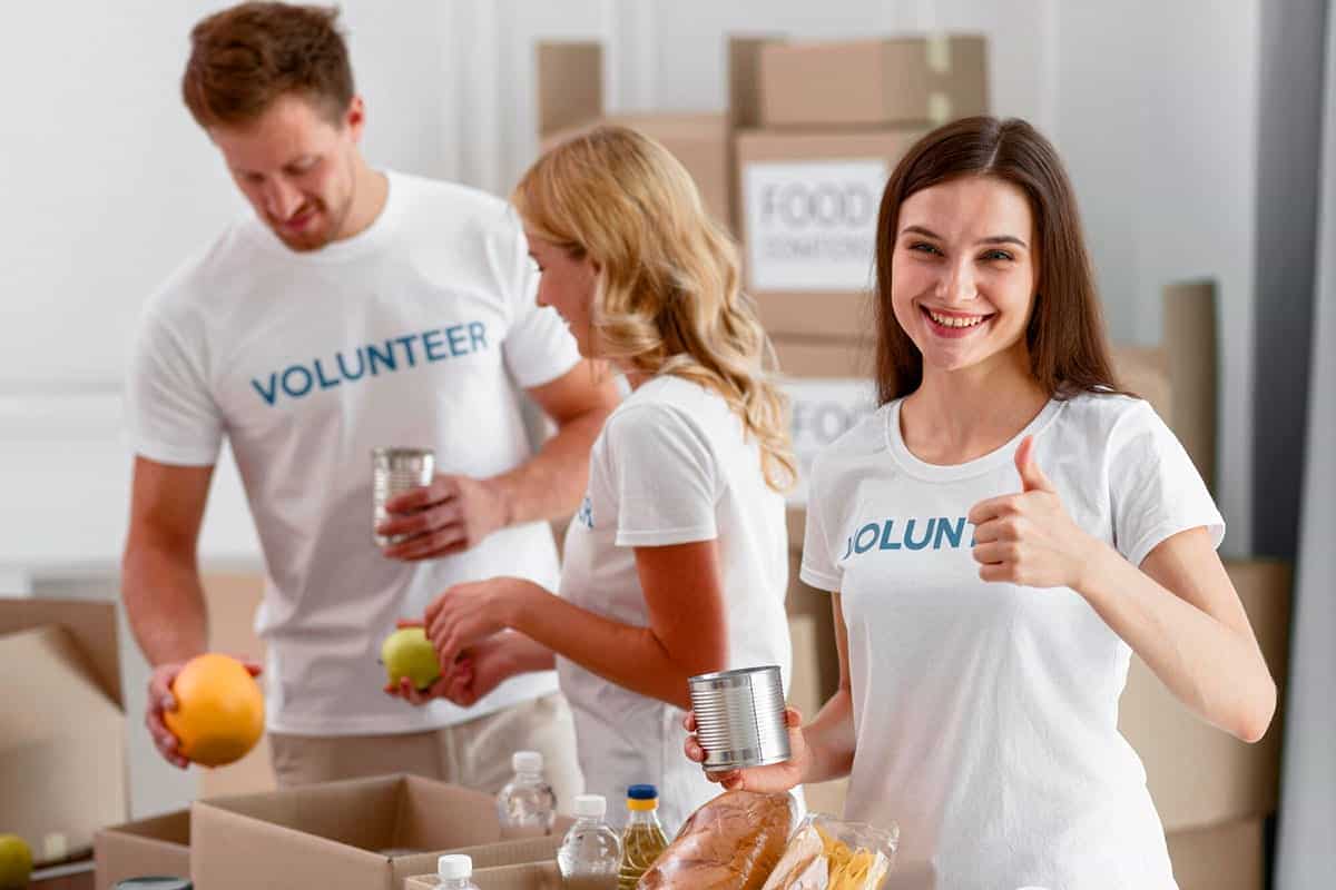Volunteers preparing food and supplies for charity